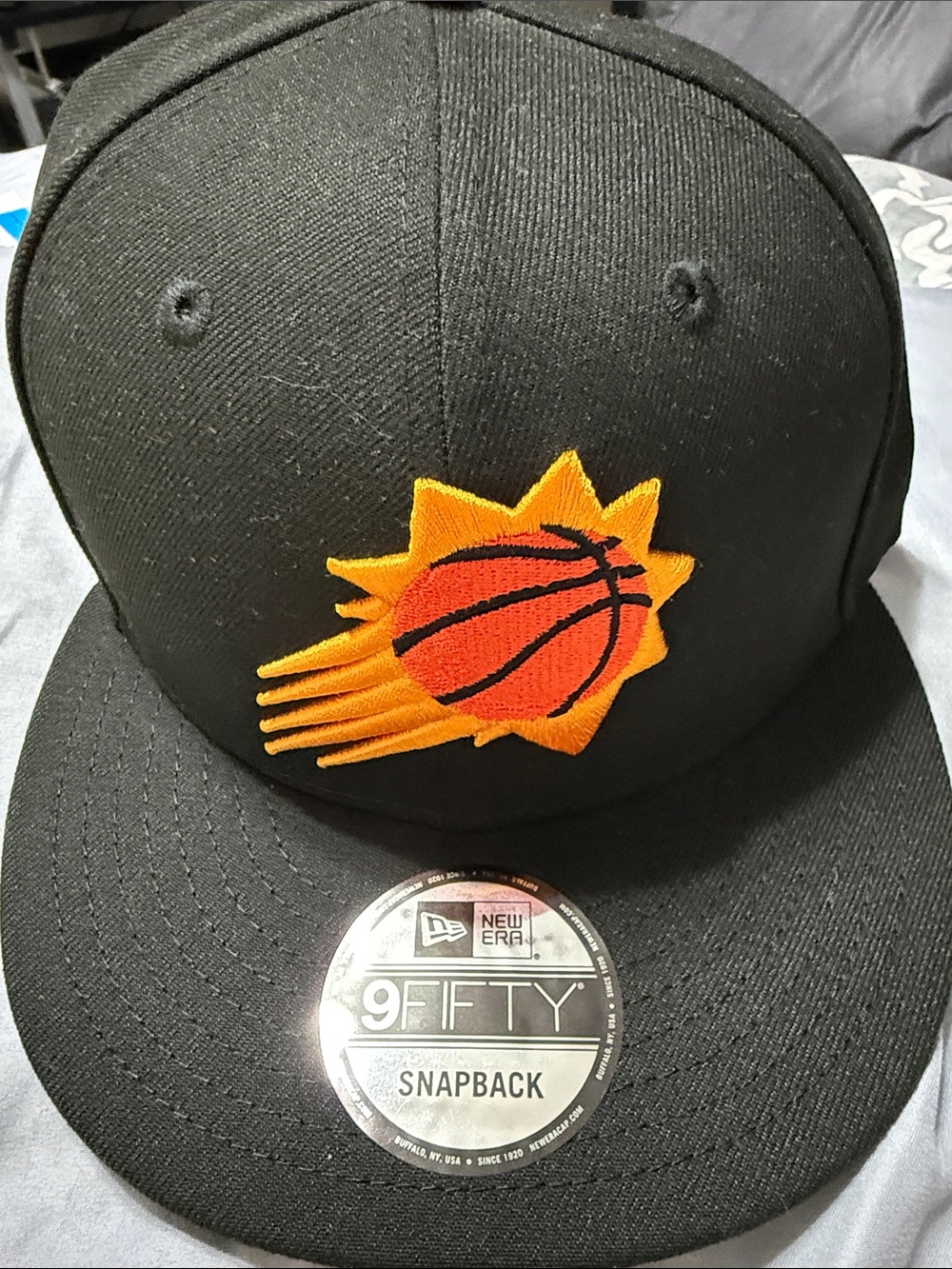 New Era men’s black Snapback with Orange & Yellow Basketball Patch